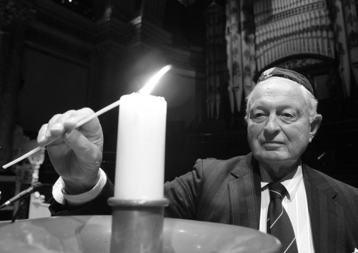 Rudi Leavor lights the Memorial Candle on Holocaust Memorial Day at Leeds Town Hall - image credit: Yorkshire Evening Post